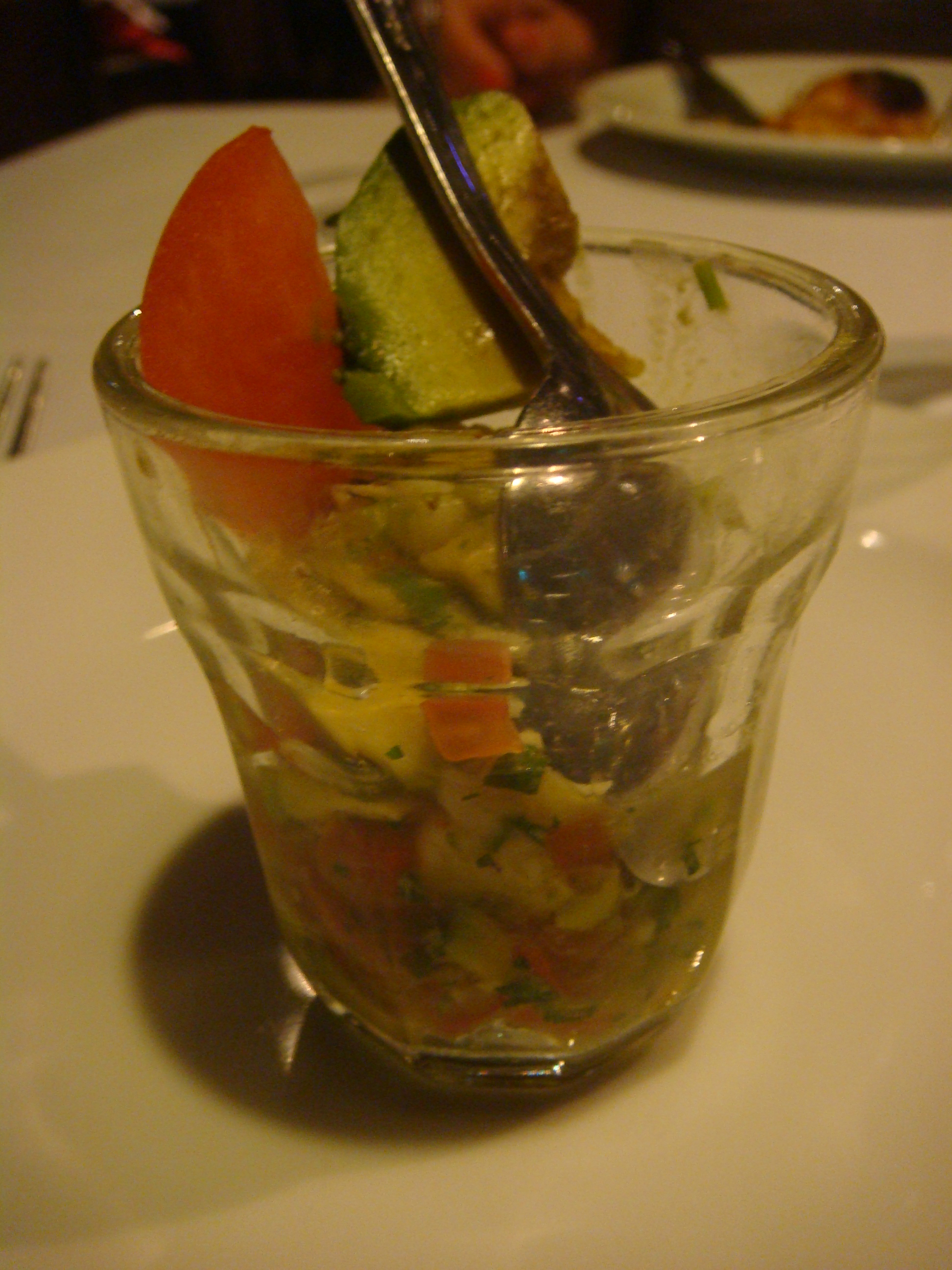Ceviche cocktail with tomatoes and avocado