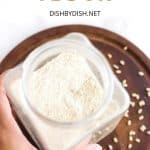 Holding a jar of rice flour.