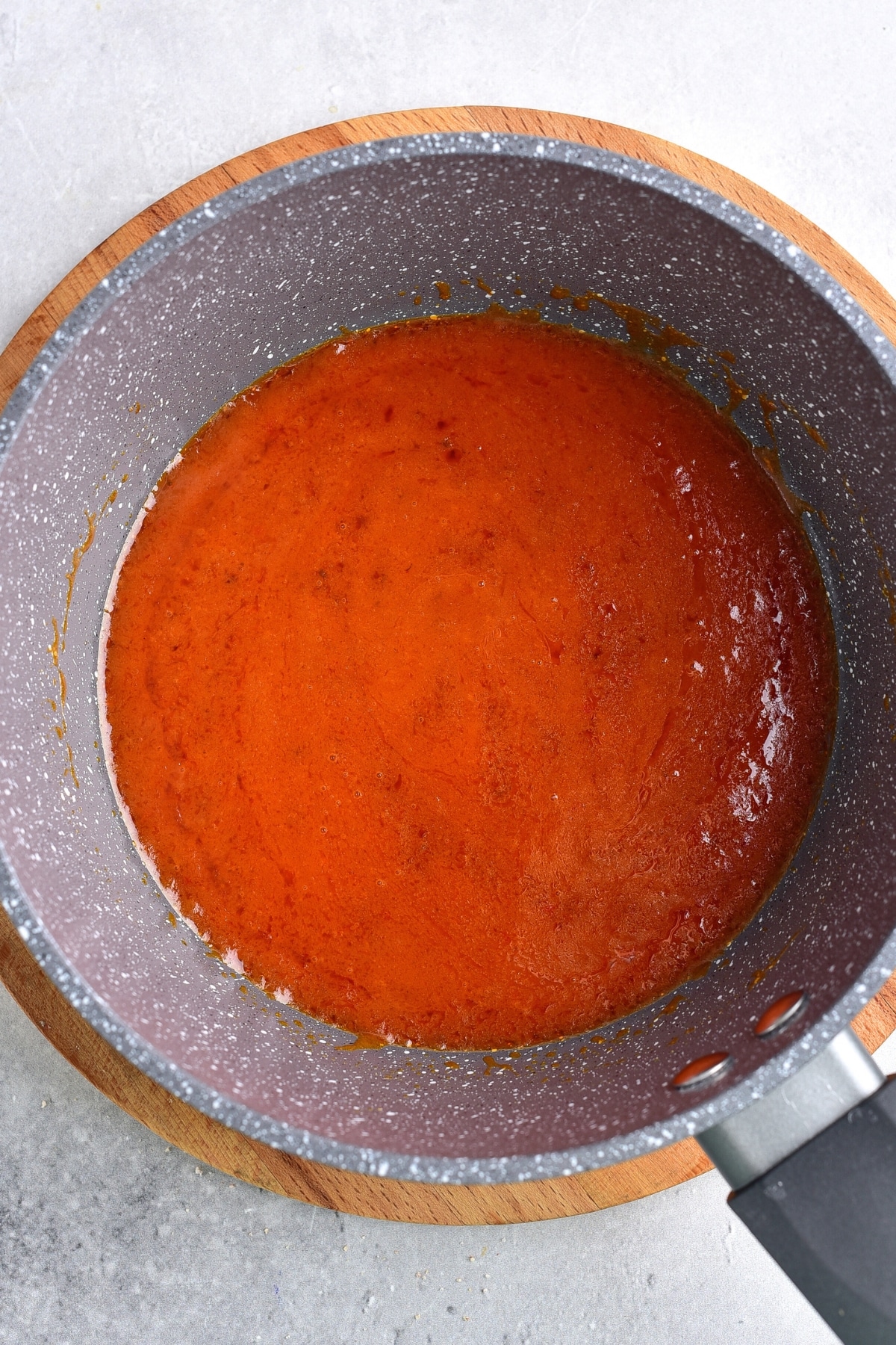 Preparing Buffalo sauce in saucepan.