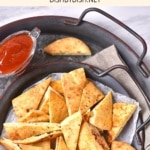Top down view of gluten-free pita toasts and salsa.