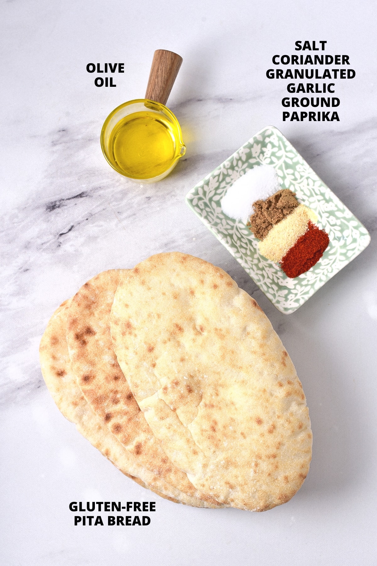 Ingredients for air fryer pita chips recipe laid out on marble board.