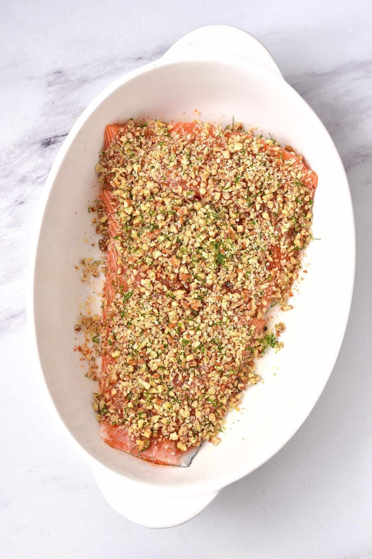 Fresh salmon topped with chopped almonds.