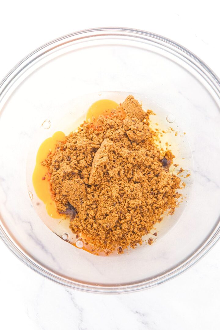 A bowl with eggs and brown sugar