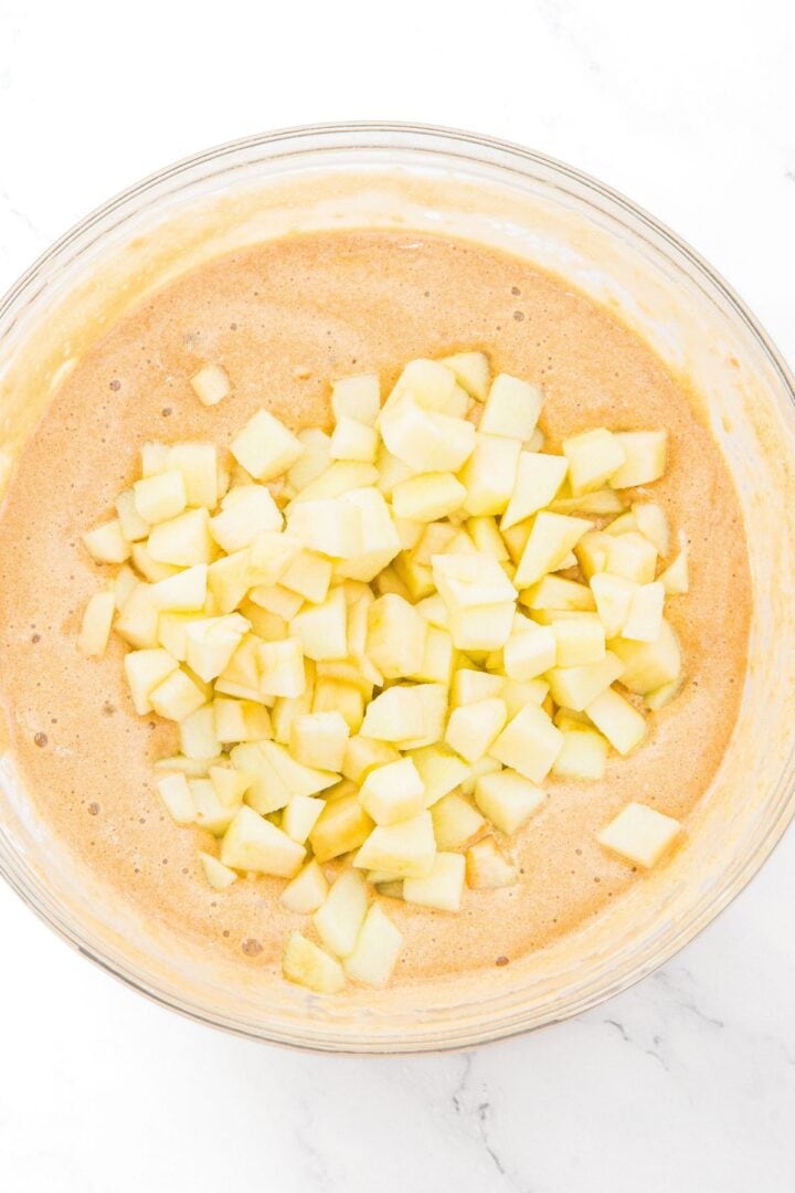Diced apples on top of cake batter