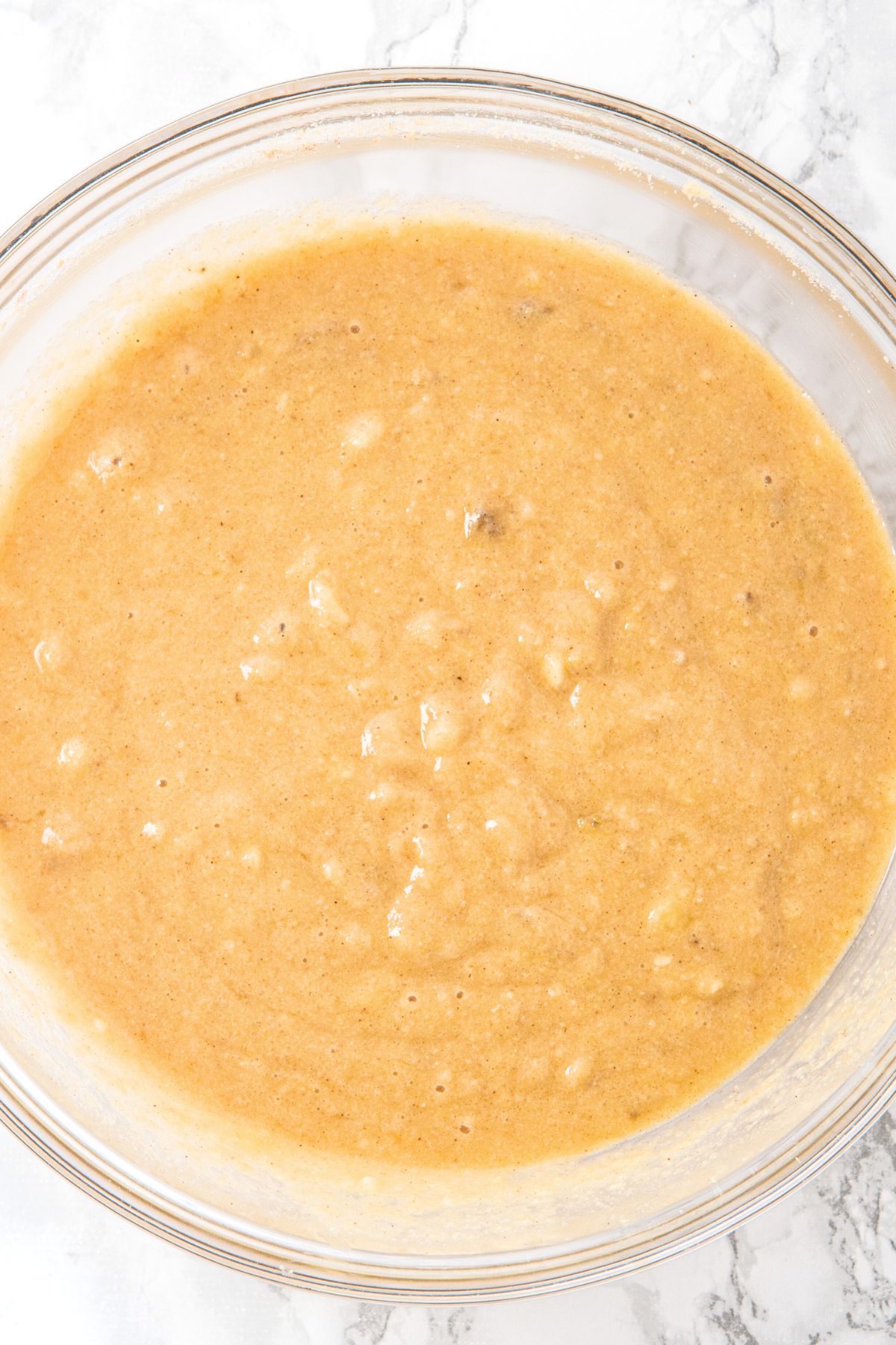 Almond flour banana bread batter in glass bowl