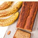 Top down view of sliced banana loaf on parchment paper