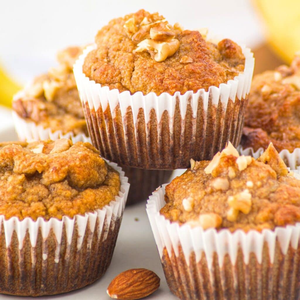 Up close view of a stack of almond flour banana nut muffins