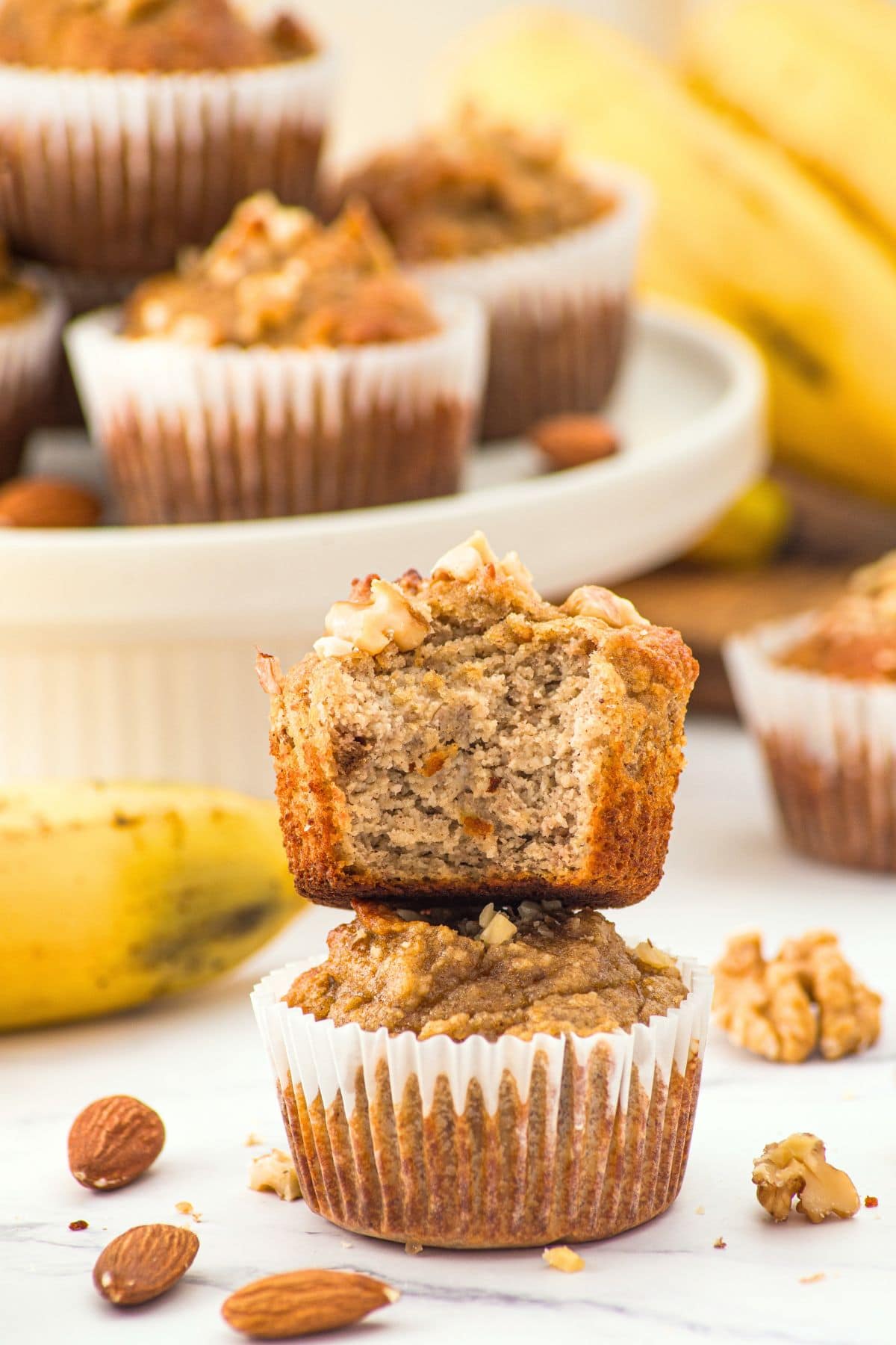 A stack of half-eaten banana nut muffins with almond flour