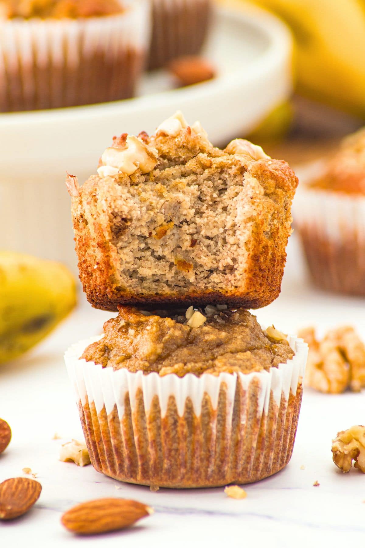 A stack of half-eaten banana nut muffins with almond flour