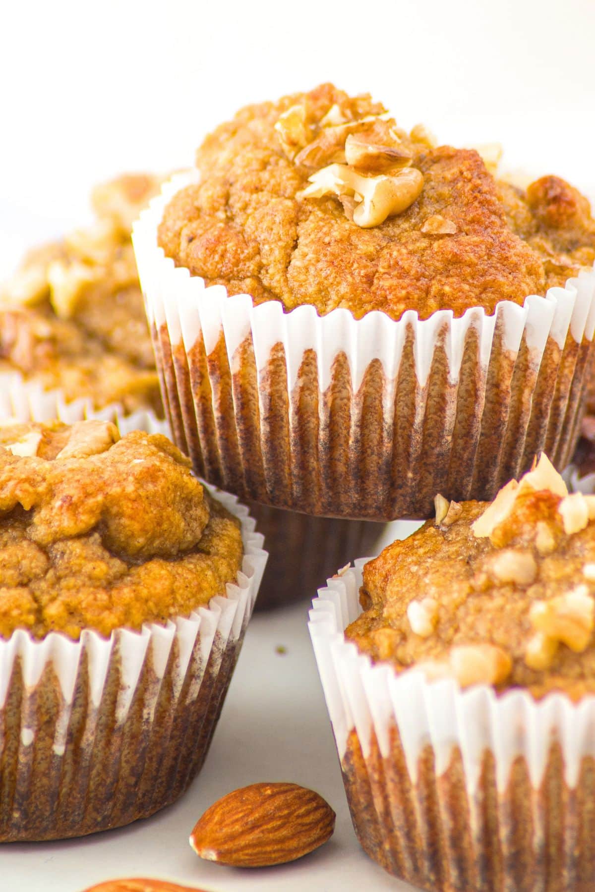 Up close view of a stack of almond flour banana nut muffins.