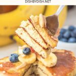 Fork holding up a stack of cut almond flour pancakes