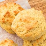 Top down view of biscuits on parchment-lined board