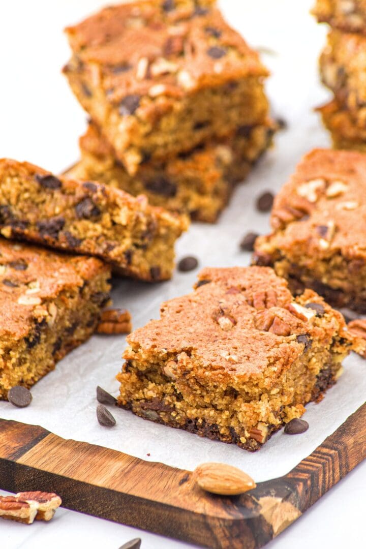 Gluten-free blondies with almond flour on parchment-lined board.