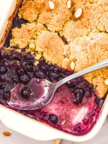 Half-eaten almond flour blueberry cobbler