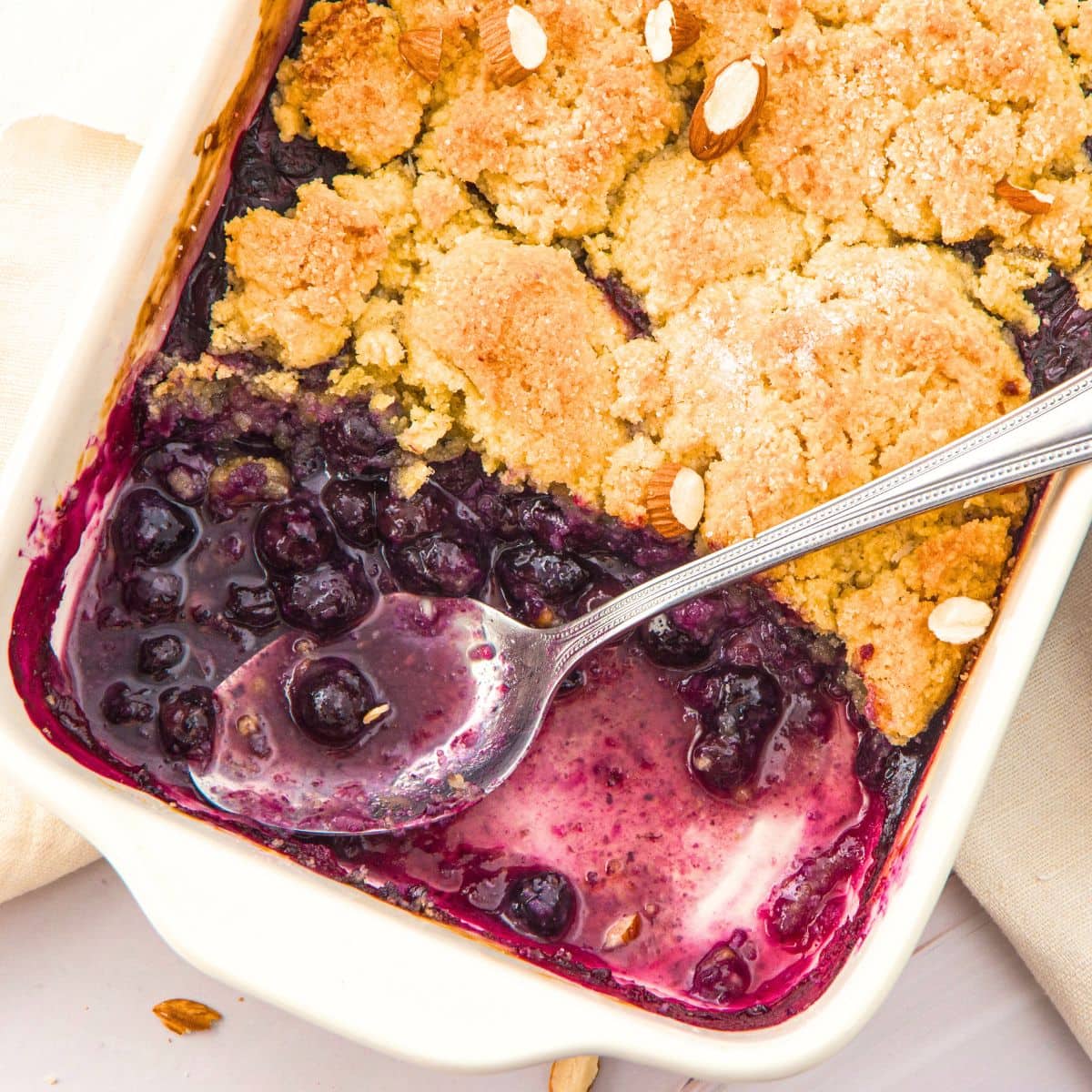 Half-eaten almond flour blueberry cobbler