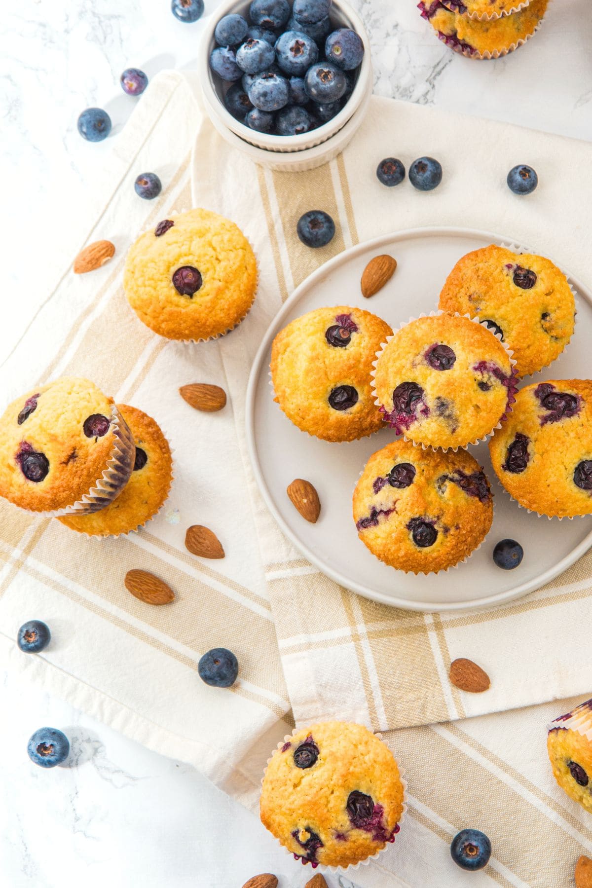 Top down view of almond flour lemon blueberry muffins on plate