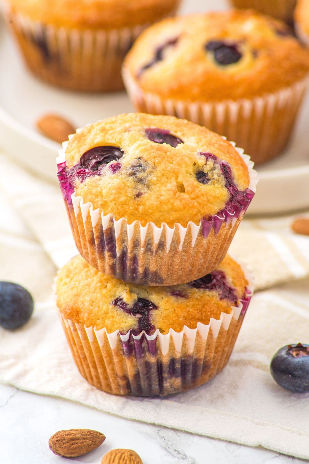 A stack of almond flour blueberry lemon muffins