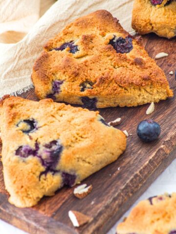 Almond flour blueberry scones on wooden board