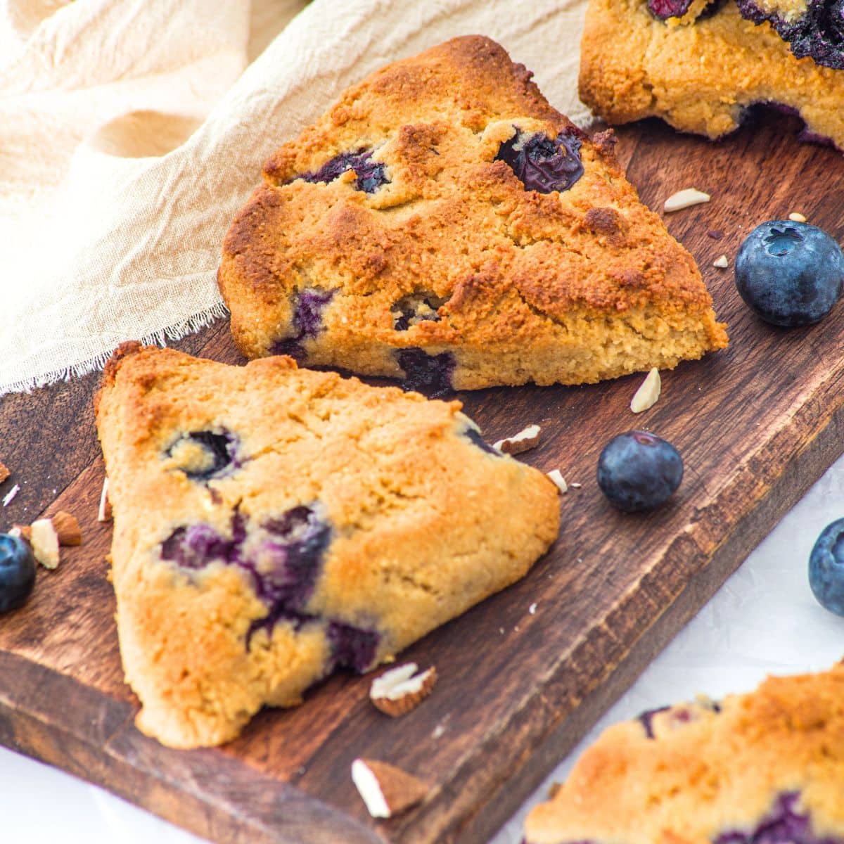 Almond flour blueberry scones on wooden board