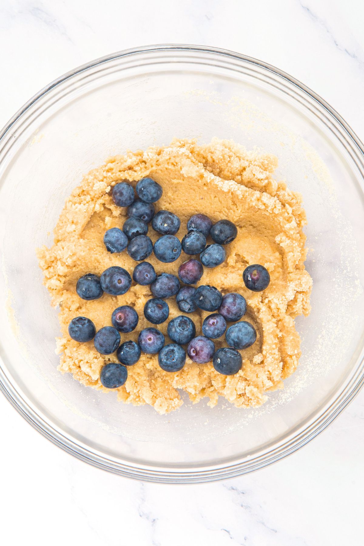 Fresh blueberries on top of almond flour scone dough