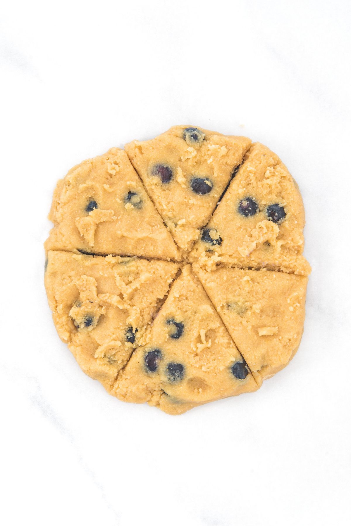Scone dough cut into six triangles