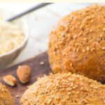 Low carb almond flour bread rolls on wooden board