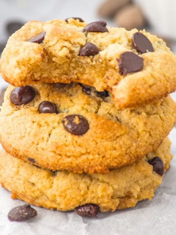 A stack of half-eaten almond flour chocolate chip cookies