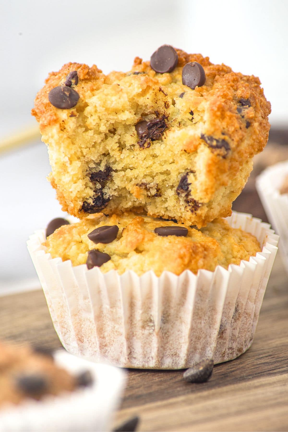 Half-eaten stack of gluten-free almond flour chocolate chip muffins.