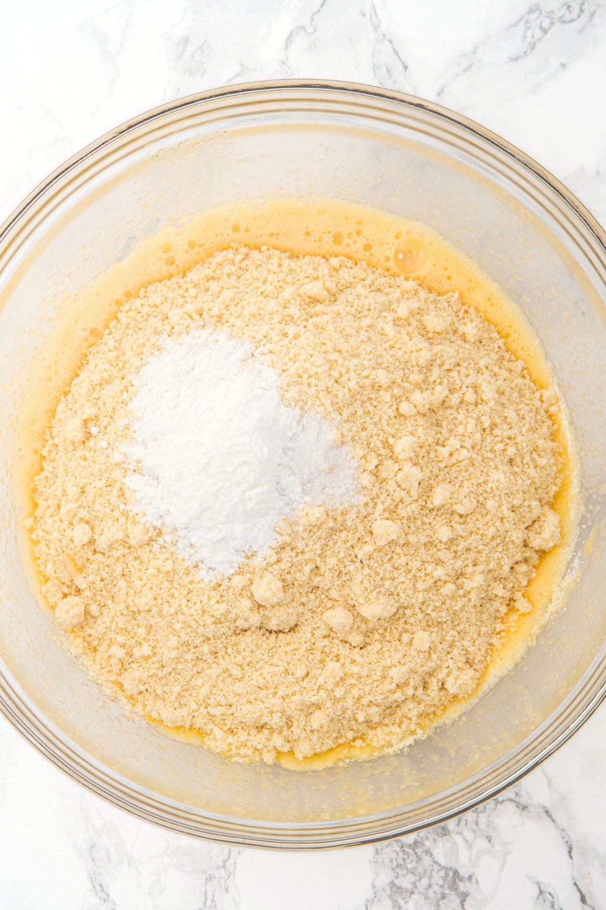 Flour mixture on in glass mixing bowl