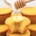 Drizzling honey over almond flour cornbread muffins