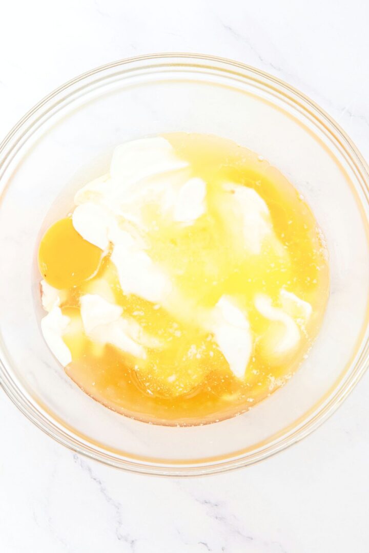 A bowl with eggs, yogurt, honey and melted butter