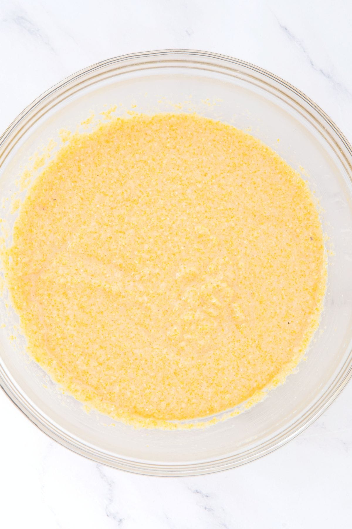 Cornbread batter in glass bowl