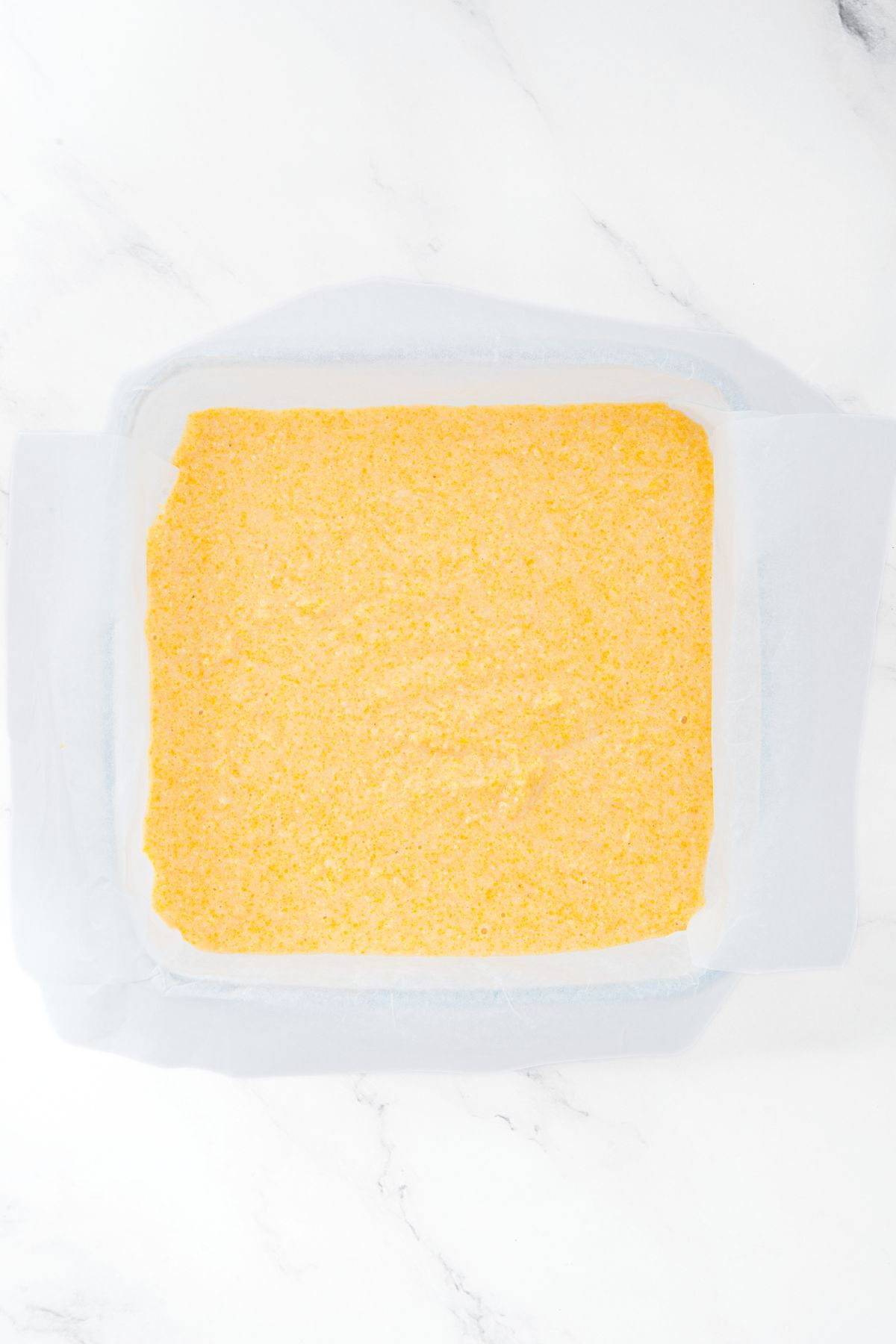 Cornbread batter in glass pan