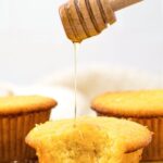 Drizzling honey over almond flour cornbread muffins