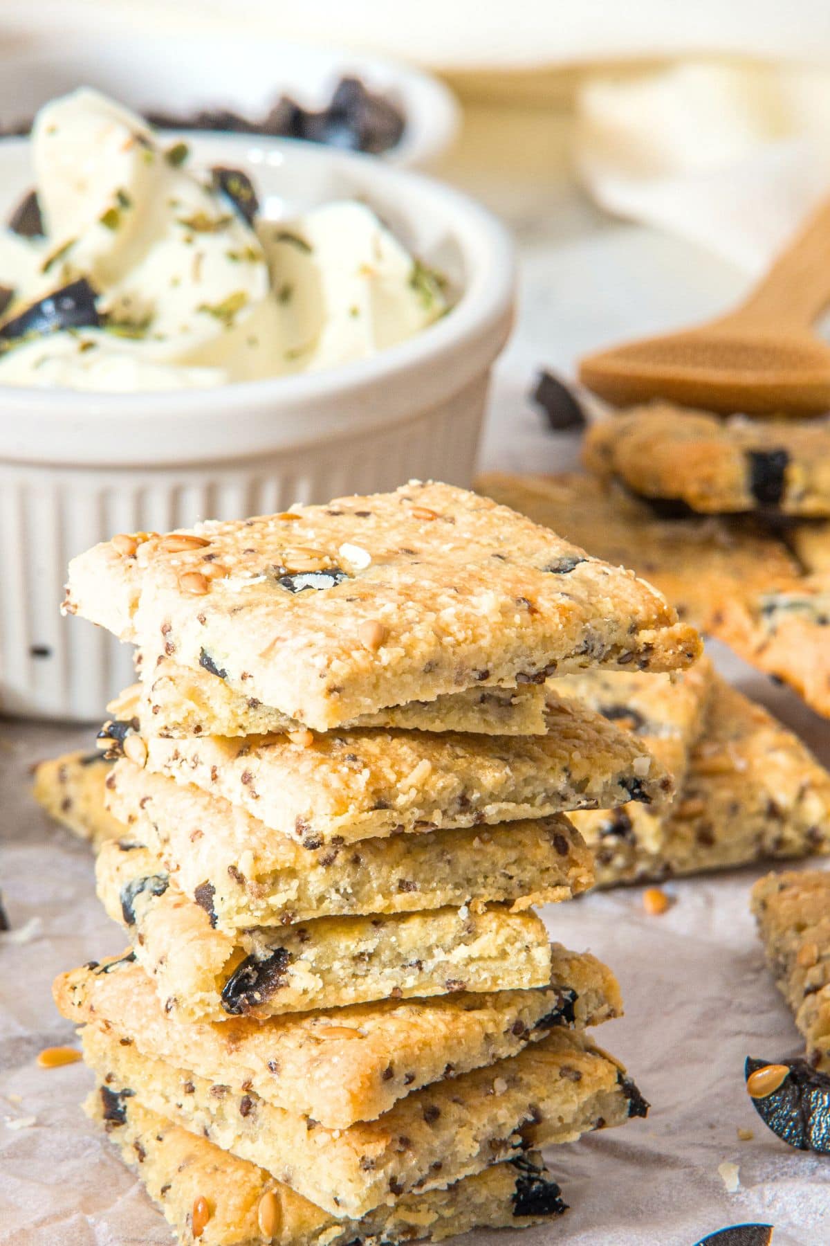A stack of almond flour cheese crackers on parchment