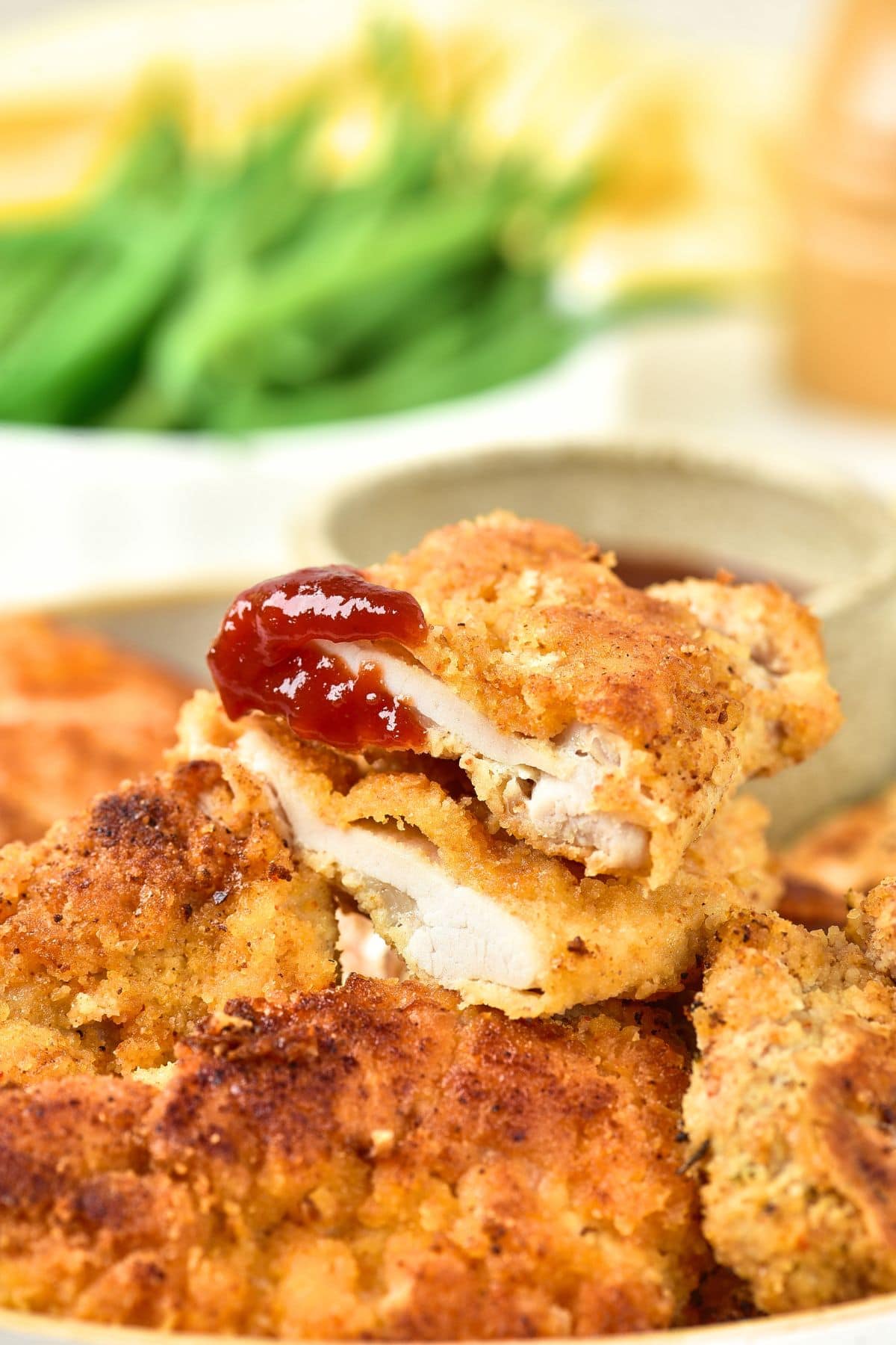 Up close view of half-eaten almond flour breaded chicken