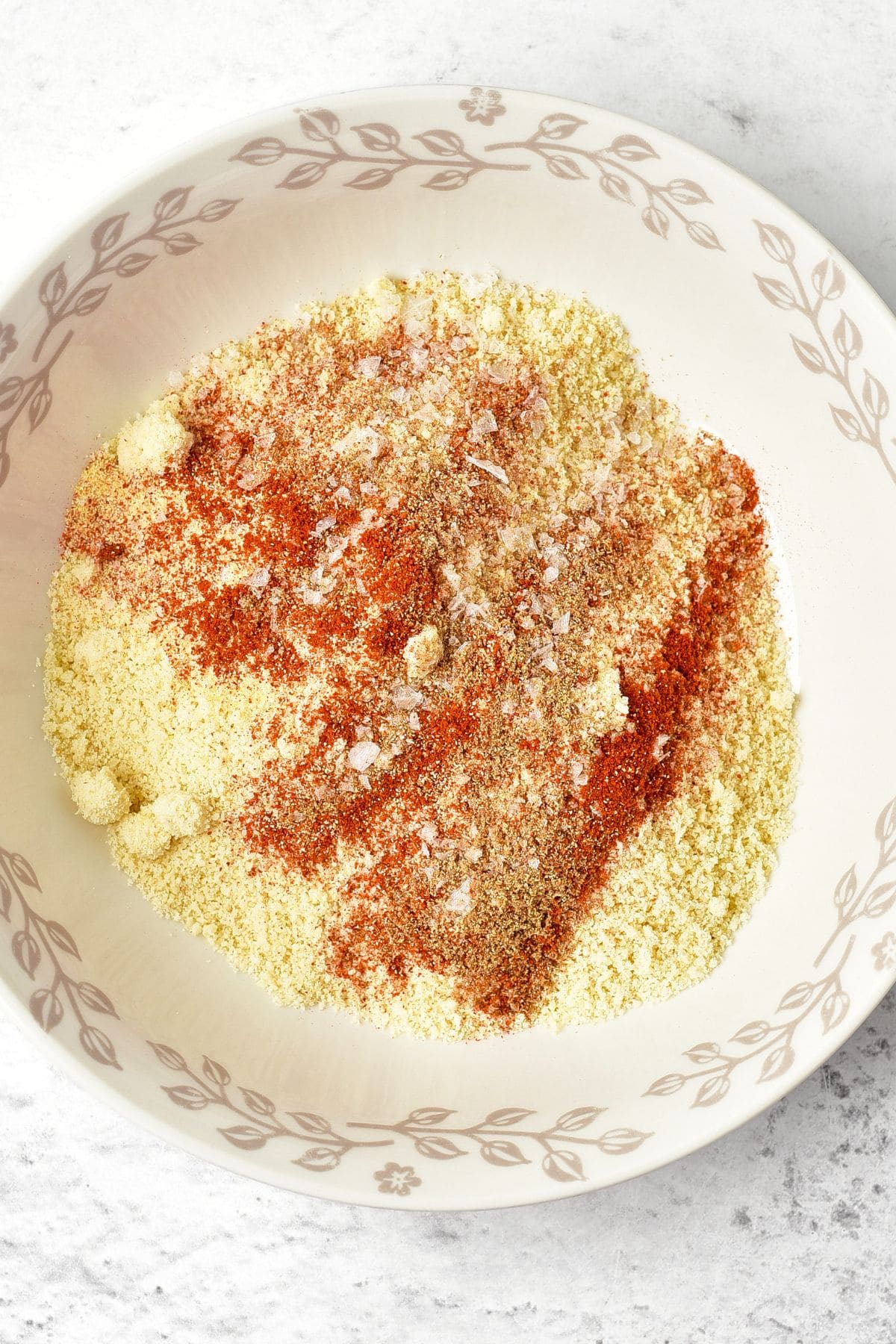 A bowl of blanched almond flour with condiments