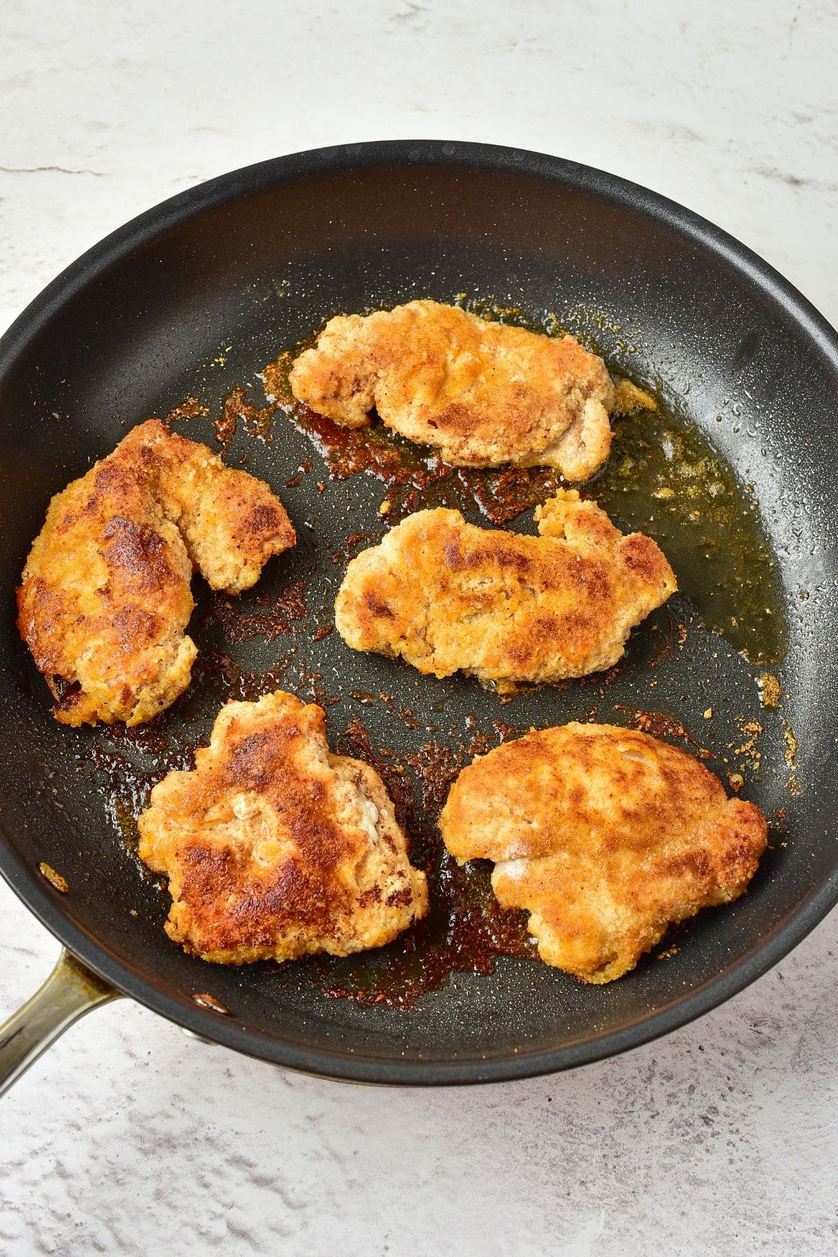 Pan-frying almond flour chicken in skillet