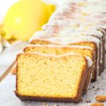 Sliced almond flour lemon loaf on parchment paper.