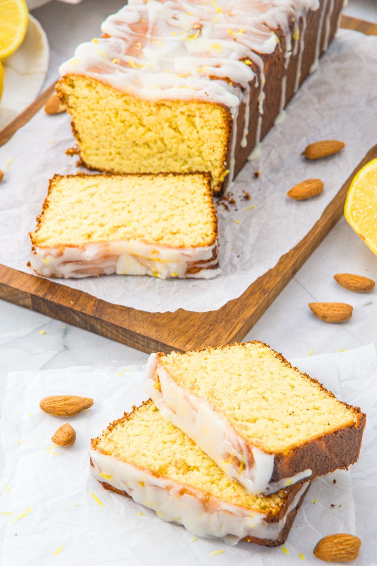 Slices of almond flour lemon bread on parchment paper.