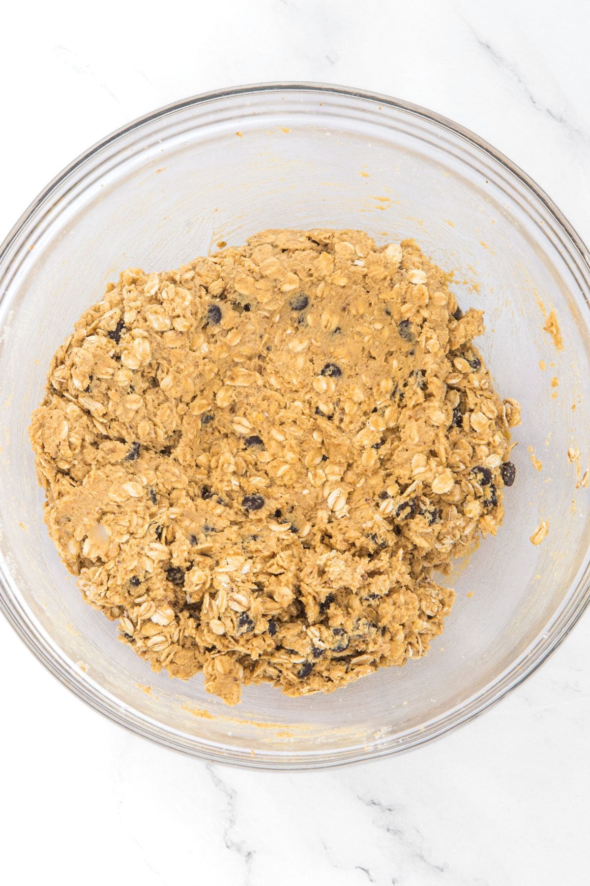 Oatmeal cookies dough in glass bowl