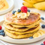 A stack of almond flour banana pancakes on a plate.