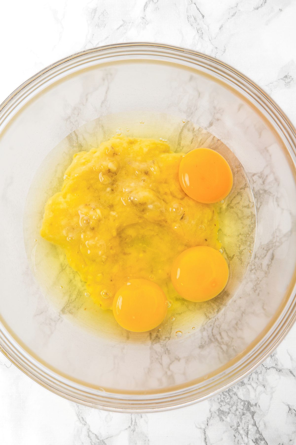 A bowl of mashed bananas and eggs.