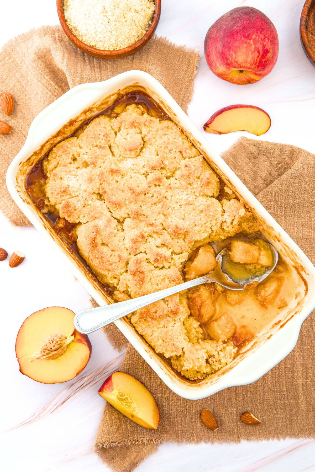 Peach Cobbler with Almond Flour (Gluten-Free, Dairy-Free) Half-eaten peach cobbler with almond flour.