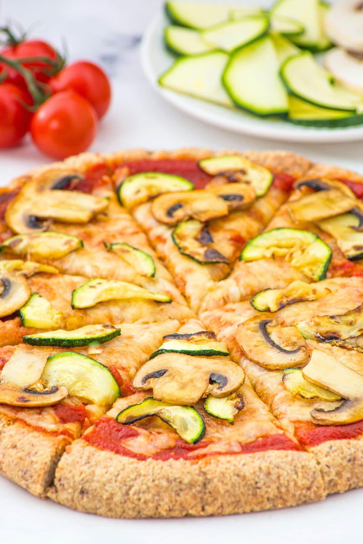 Sliced pizza with mushrooms and zucchini