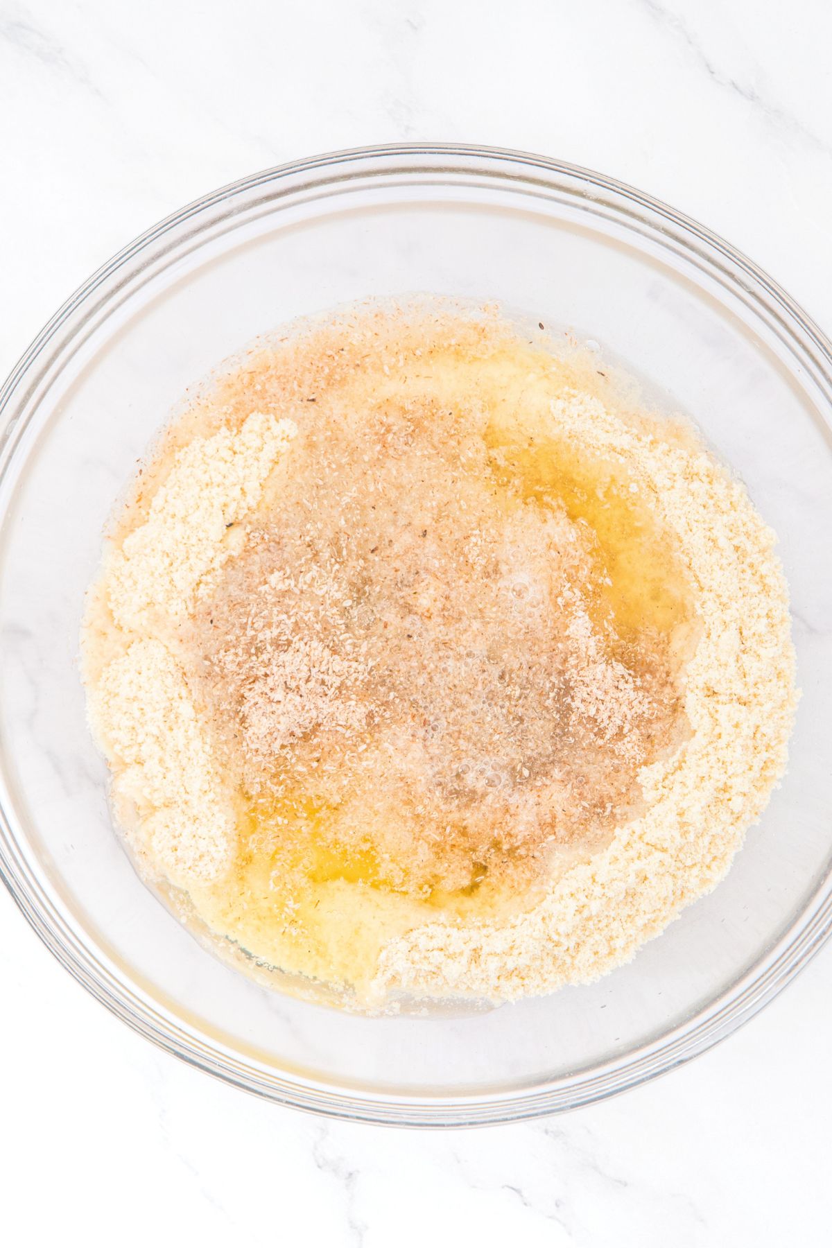 A bowl with almond flour, psyllium husk powder, egg white.