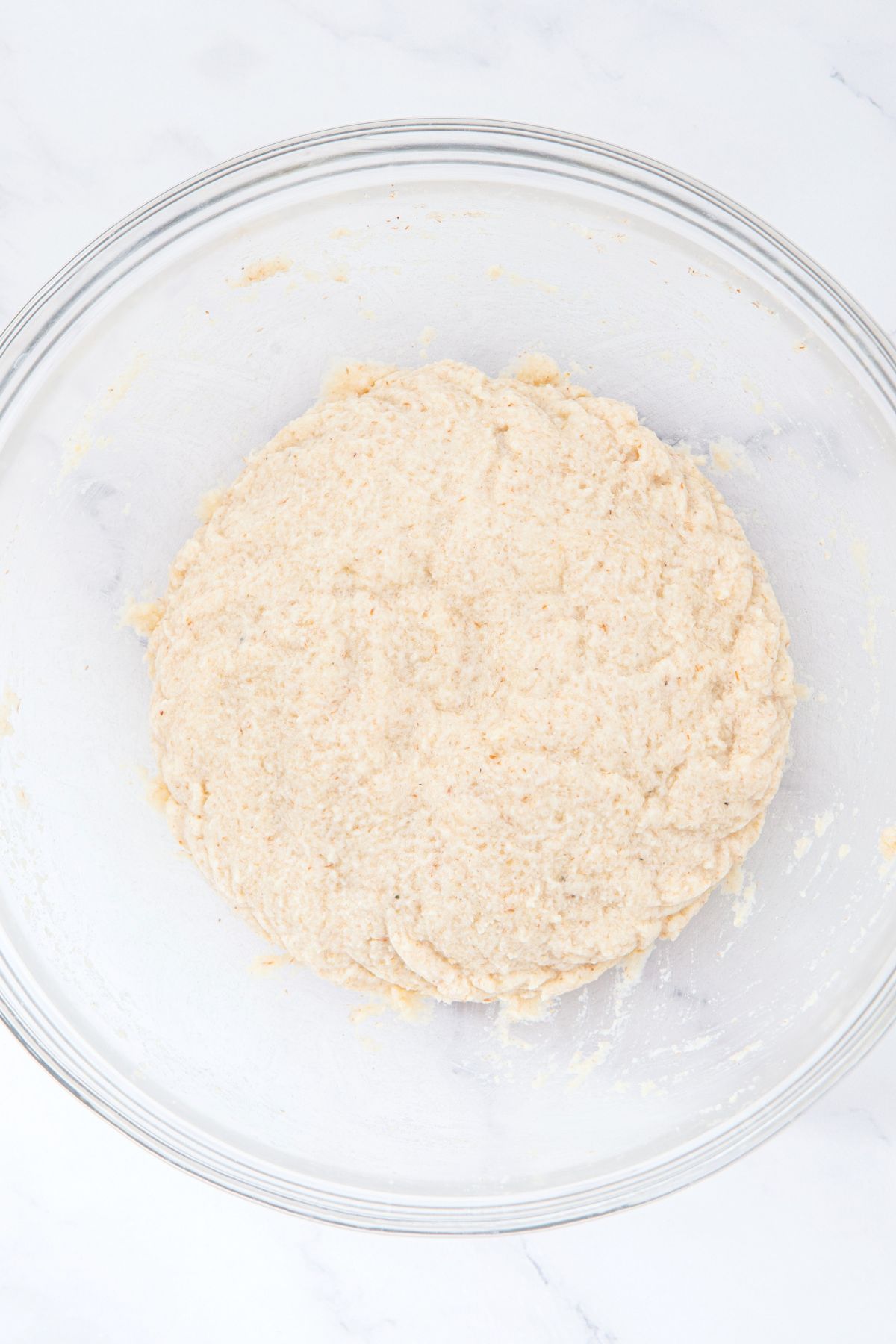 Pizza crust dough in mixing bowl