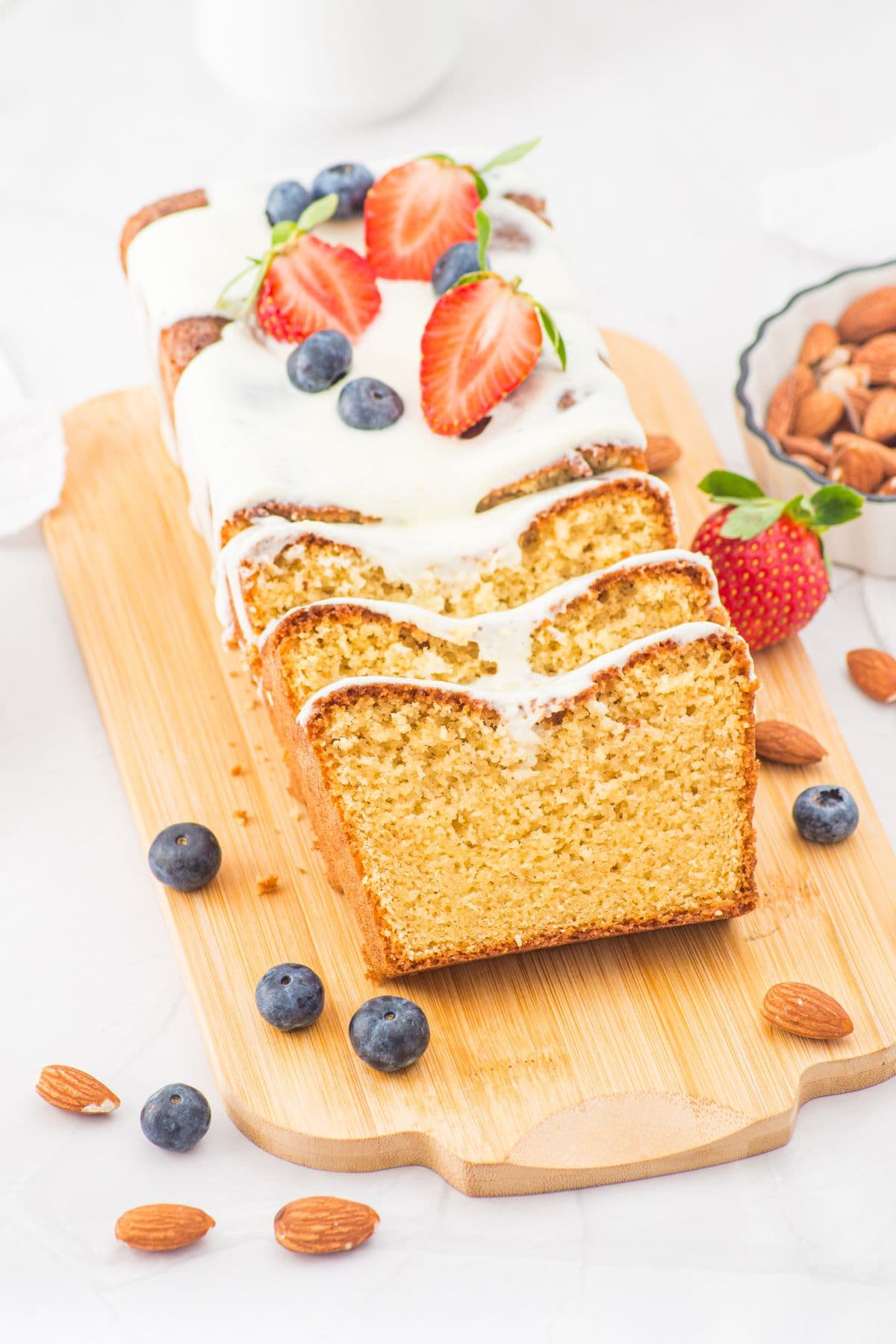 Sliced almond flour pound cake on wooden board