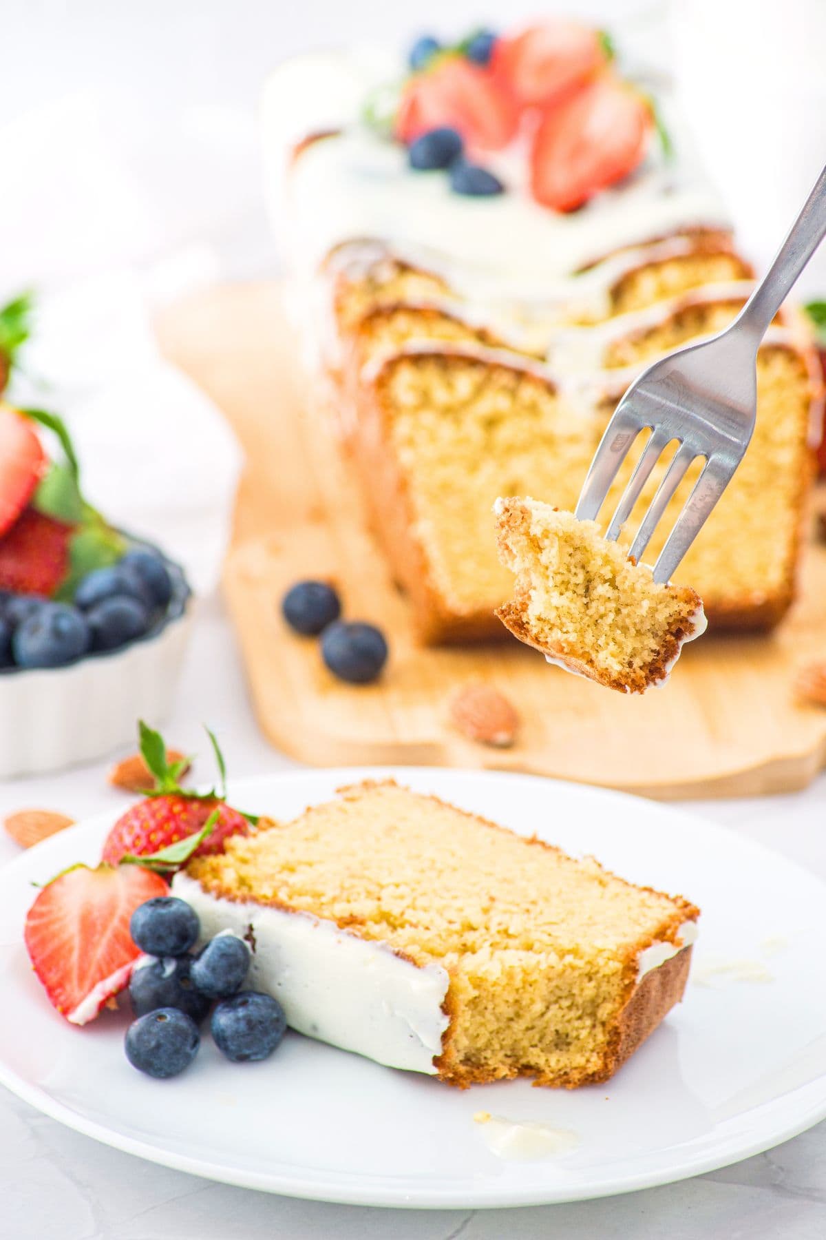 Holding up a forkful of almond flour cake from a plate