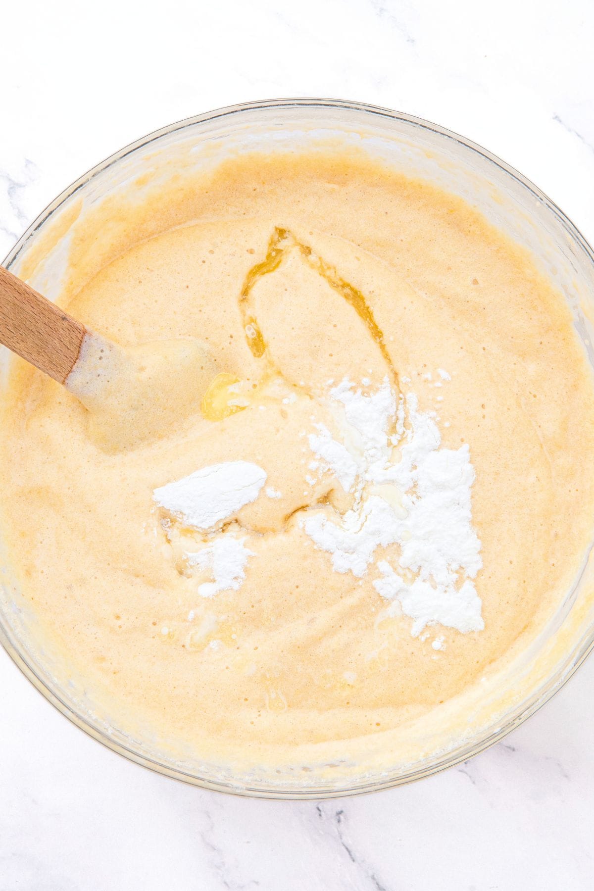 Mixing baking powder and melted butter into batter